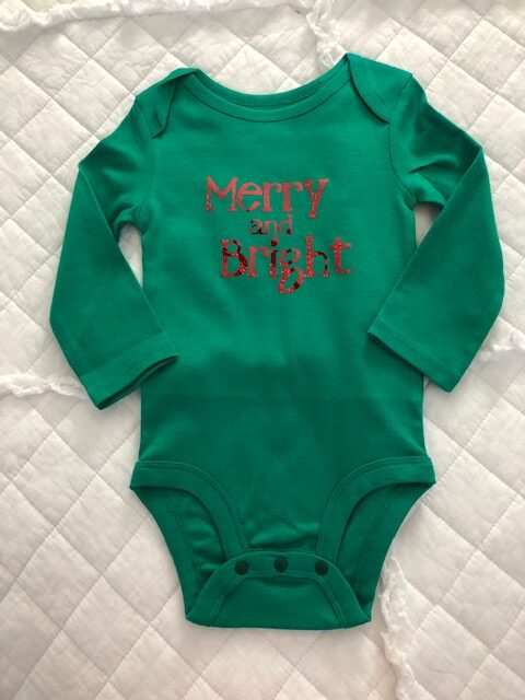 Make your own DIY Christmas bodysuits for baby with this easy beginner Cricut project. These simple iron on designs are quick to make and so cute!