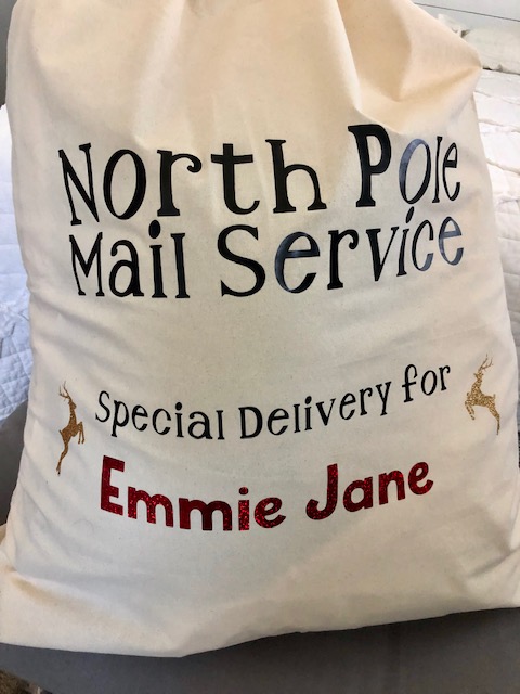Make Christmas morning extra magical for your kids with this simple, frugal, and quick DIY personalized Santa sack project with your Cricut machine.