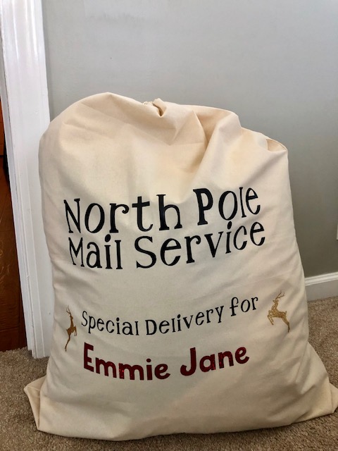 Make Christmas morning extra magical for your kids with this simple, frugal, and quick DIY personalized Santa sack project with your Cricut machine.