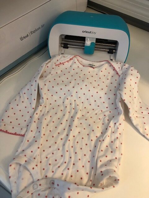 Make your own easy, quick, and frugal DIY Valentine's Day shirt for Baby with this step by step beginner Cricut iron on tutorial.