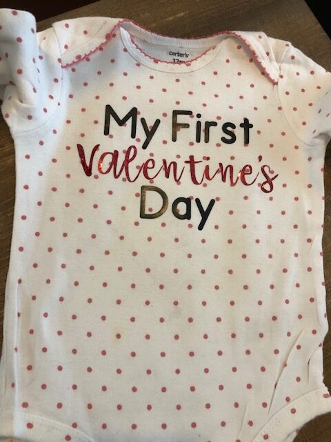 Make your own easy, quick, and frugal DIY Valentine's Day shirt for Baby with this step by step beginner Cricut iron on tutorial.
