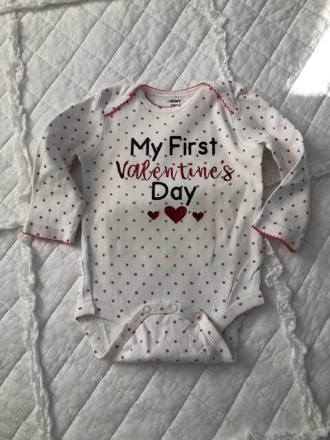 Make your own easy, quick, and frugal DIY Valentine's Day shirt for Baby with this step by step beginner Cricut iron on tutorial.